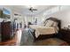 Spacious primary bedroom with wood floors, bay windows, and ceiling fan at 2515 Ridgewind Way, Windermere, FL 34786