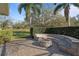 Beautiful fire pit area with curved stone seating with view of property at 2515 Ridgewind Way, Windermere, FL 34786