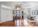 Spacious foyer with wood floors, decorative front door, and dining room view at 2515 Ridgewind Way, Windermere, FL 34786