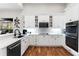 Bright white kitchen with modern appliances and herringbone tile backsplash at 2515 Ridgewind Way, Windermere, FL 34786