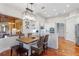 Eat-in kitchen with stainless steel appliances, white cabinets, and seating area at 2515 Ridgewind Way, Windermere, FL 34786