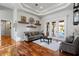 Comfortable living room with tray ceilings and sliding glass doors to outdoor pool at 2515 Ridgewind Way, Windermere, FL 34786
