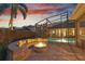 Outdoor pool area with fire pit and scenic sunset view at 2515 Ridgewind Way, Windermere, FL 34786