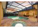 Sparkling pool and spa with screened enclosure and sunset views at 2515 Ridgewind Way, Windermere, FL 34786
