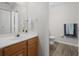 Well-lit bathroom with a single sink vanity and tile floors at 2604 Lodi Cir # 103, Kissimmee, FL 34746