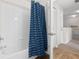 Full bathroom with tub/shower combo and blue curtain at 2604 Lodi Cir # 103, Kissimmee, FL 34746