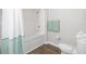 Bathroom featuring a shower, a bathtub and a toilet with towels on the side at 2604 Lodi Cir # 103, Kissimmee, FL 34746