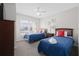Bright bedroom featuring two beds with red pillows and nautical Mickey Mouse decor at 2604 Lodi Cir # 103, Kissimmee, FL 34746
