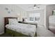 Bedroom features two twin beds with matching decor, side tables, and a ceiling fan at 2604 Lodi Cir # 103, Kissimmee, FL 34746