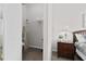 Walk-in closet offering ample storage space, ironing board and a wire rack at 2604 Lodi Cir # 103, Kissimmee, FL 34746