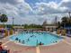 Large community pool with ample lounge seating, perfect for relaxation and recreation at 2604 Lodi Cir # 103, Kissimmee, FL 34746