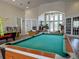 Spacious game room with pool table, arcade games, comfortable seating, and ample natural light at 2604 Lodi Cir # 103, Kissimmee, FL 34746
