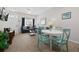 Open-concept living space with comfortable seating, a dining area, and natural light at 2604 Lodi Cir # 103, Kissimmee, FL 34746