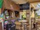 Outdoor tiki bar with a TV, comfortable seating, and a fun, tropical atmosphere at 2604 Lodi Cir # 103, Kissimmee, FL 34746