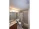 Bathroom featuring a tub/shower combo with a gray shower curtain, a mirror, a vanity, and tile floors at 2678 Autumn Creek Cir, Kissimmee, FL 34747