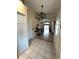 Inviting tiled foyer with high ceilings, decorative lighting, and direct access to the main living areas at 2678 Autumn Creek Cir, Kissimmee, FL 34747