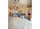 Spacious living room featuring tiled floors, a comfortable sectional, and an arched doorway at 2678 Autumn Creek Cir, Kissimmee, FL 34747