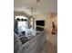 Bright living room showcasing tiled floors, a large sectional sofa, and sliding glass doors to the patio at 2678 Autumn Creek Cir, Kissimmee, FL 34747