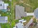 Aerial view showcasing the property, including the house, driveway, and surrounding landscape at 2776 Tropical Lake Dr, Kissimmee, FL 34741