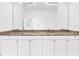 Bathroom vanity featuring double sinks and a large mirror at 2776 Tropical Lake Dr, Kissimmee, FL 34741