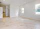 A bright bedroom featuring tile floors and a view of an adjoining bathroom at 2776 Tropical Lake Dr, Kissimmee, FL 34741