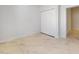 A bedroom featuring a closet and a door that gives access to another room at 2776 Tropical Lake Dr, Kissimmee, FL 34741