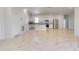 Open kitchen design featuring white cabinets, stainless appliances and marble-look floors at 2776 Tropical Lake Dr, Kissimmee, FL 34741