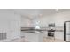 Bright kitchen with white cabinets, stainless steel appliances and a central island at 2776 Tropical Lake Dr, Kissimmee, FL 34741