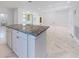 Spacious kitchen with granite island, offering plenty of countertop and storage space at 2776 Tropical Lake Dr, Kissimmee, FL 34741