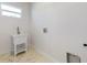 Bright laundry room featuring a utility sink, window, and hookups at 2776 Tropical Lake Dr, Kissimmee, FL 34741