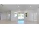 Bright, open living space with white walls, recessed lighting and sliding doors at 2776 Tropical Lake Dr, Kissimmee, FL 34741