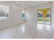 Living room with windows offering natural light, complemented by sliding glass doors to the backyard at 2776 Tropical Lake Dr, Kissimmee, FL 34741