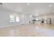 Bright living room featuring large windows, recessed lighting, and tile flooring throughout at 2776 Tropical Lake Dr, Kissimmee, FL 34741