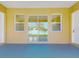 Enclosed patio featuring sliding glass doors and neutral colors at 2776 Tropical Lake Dr, Kissimmee, FL 34741