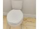Close-up of a toilet with white porcelain and standard plumbing fixtures in a bathroom at 2776 Tropical Lake Dr, Kissimmee, FL 34741