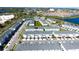 Aerial view of a community with townhomes, lakes and surrounding cityscape at 2909 Theme St, Kissimmee, FL 34746