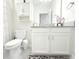 Bright bathroom featuring white cabinets, neutral-colored walls, and a shower with a white curtain at 2909 Theme St, Kissimmee, FL 34746
