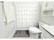 Bright bathroom featuring a shower with a white curtain and white vanity at 2909 Theme St, Kissimmee, FL 34746