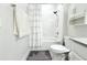 Bright bathroom featuring a shower with a white curtain, vanity, and neutral color walls at 2909 Theme St, Kissimmee, FL 34746
