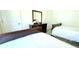 Bedroom featuring two beds with a dark wood dresser and neutral colored walls at 2909 Theme St, Kissimmee, FL 34746