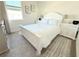Bedroom featuring a bed with white linens and furniture and neutral colored walls at 2909 Theme St, Kissimmee, FL 34746