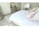 Bedroom featuring carpet flooring, dresser with mirror, and neutral colored walls at 2909 Theme St, Kissimmee, FL 34746