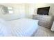 Bedroom with carpet flooring, dresser, and neutral colored walls at 2909 Theme St, Kissimmee, FL 34746