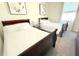 Bedroom featuring two beds with a view of a window and neutral colored walls at 2909 Theme St, Kissimmee, FL 34746