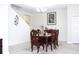 A dining room featuring a dark wood table, elegant chairs, and neutral decor at 2909 Theme St, Kissimmee, FL 34746