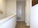 Upper hallway with carpet flooring, white walls, and view of white doors at 2909 Theme St, Kissimmee, FL 34746