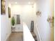 Hallway with carpet flooring and decorative elements on the walls, adding visual interest and style at 2909 Theme St, Kissimmee, FL 34746