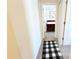 Inviting hallway with a plush rug leading to a bedroom at 2909 Theme St, Kissimmee, FL 34746