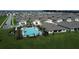 Aerial view showcasing a community pool, surrounding homes, and landscaping at 30376 Armenia Rd, Leesburg, FL 34748