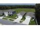 An aerial shot showcasing three homes with driveways and green lawns at 30376 Armenia Rd, Leesburg, FL 34748